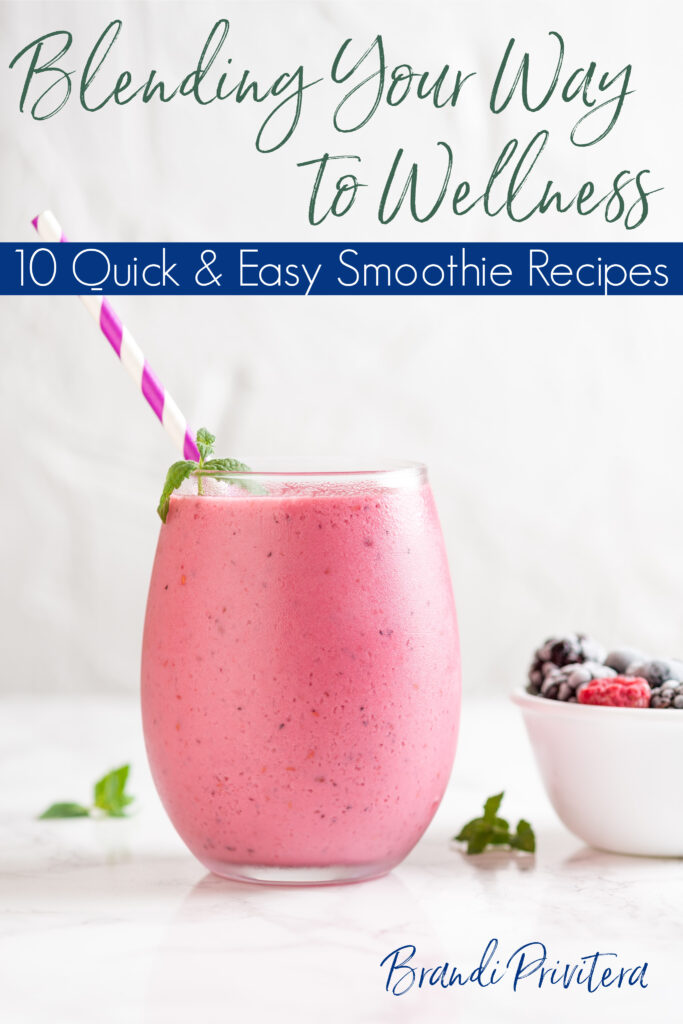 a strawberry smoothie setting next to a bowl of smoothies on a countertop